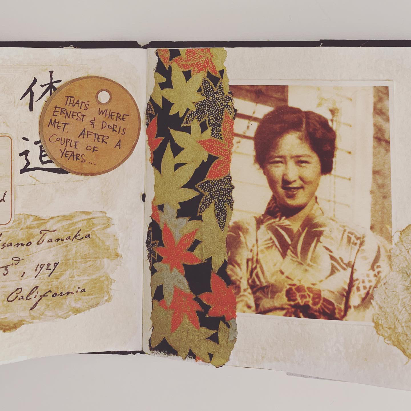 A collaged mixed media page of a handmade book with a photo of a young Japanese woman in a kimono